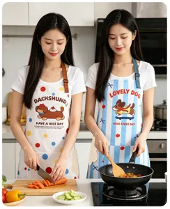 Kitchen apron detail showcasing cute cartoon dog print, waterproof fabric and comfortable wear.