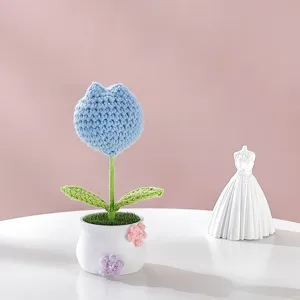 Handmade crochet blue tulip flower pot detail shot, cute knitted desk ornament gift.