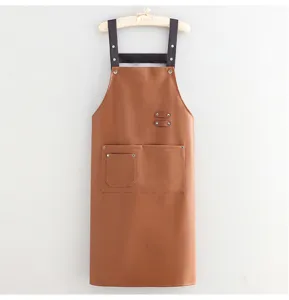 Waterproof PU leather apron for kitchen cooking, long brown work apron with multiple pockets.