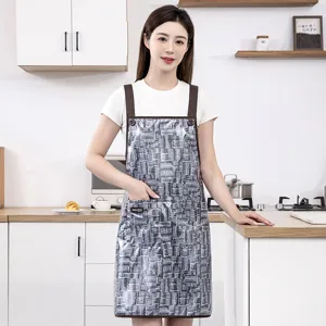 Waterproof plaid apron with straps for kitchen cooking, oil-resistant and dirt-resistant work.