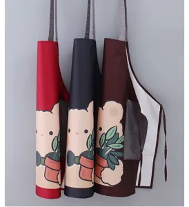 Waterproof kitchen apron with cute bear print, oil-resistant cooking workwear for home use.