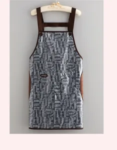Waterproof apron detail showcasing the front pocket, brown trim, and absorbent towel sides.