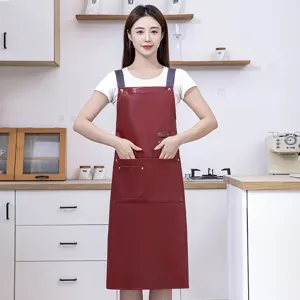 Waterproof PU leather kitchen apron for men and women, oil-proof work cooking bib style.