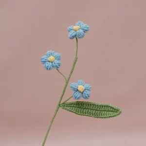 Handmade crochet blue flower stem detail close up for home decor and desktop ornament