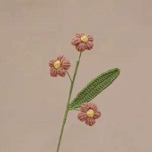 Handcrafted crochet puff flower branch detail, lovely pink petals and green leaf.