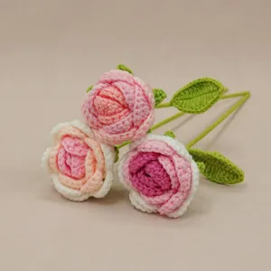 Handcrafted crochet rose bouquet, beautiful gradient pink flowers with green leaves for home.
