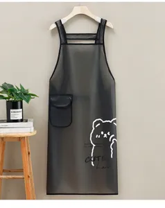 Details of transparent waterproof TPU apron with cute bear print, hanging in kitchen setting.