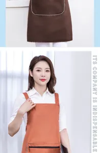 Waterproof kitchen apron with convenient pocket and stylish striped trim for daily cooking.