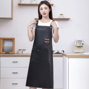 Black PU leather waterproof kitchen apron with front pockets, long utility work apron for cooking.