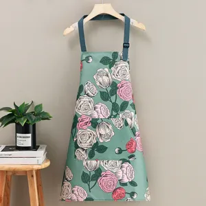 Grembiule da cucina impermeabile con stampa floreale, cinturino regolabile e tasca pratica.