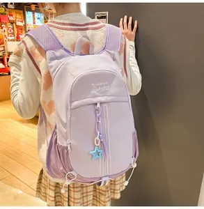 Details of the light purple candy color casual sports backpack with star pendant and large capacity.