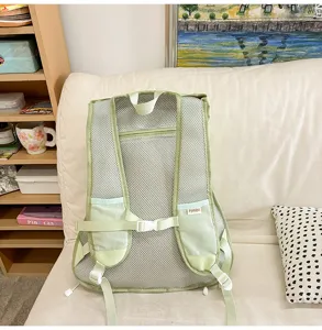 Close-up of the breathable mesh back panel and straps on the green casual backpack.