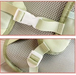 Detailed view of the light green backpack breathable mesh strap and white plastic buckle.