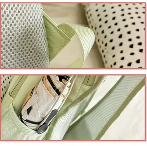 Detailed view of the light green casual backpack, showing breathable mesh straps and side pockets.