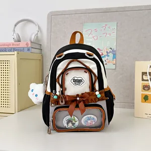 Sac à dos itabag style japonais avec fenêtre transparente, volants et nœud papillon.