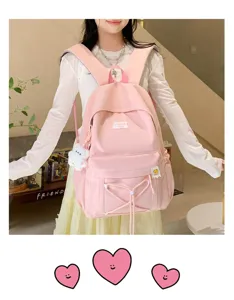 Sweet candy color pink school backpack with front pocket and cute little bear pendant for daily use.