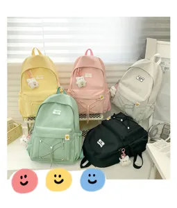 Canvas student backpack in candy colors with cute bear pendant and stylish drawstring pocket.