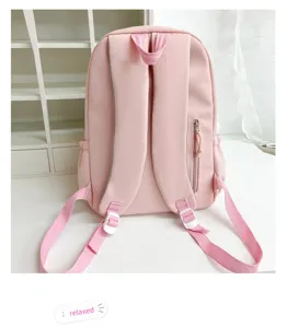 Pink student backpack detail showing adjustable straps, zipper pocket and clean design.