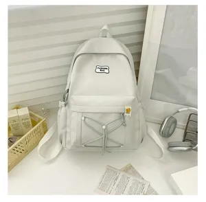 Casual student backpack with front elastic cord and patch, stylish daily school bag.