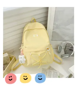 Japanese candy color student backpack, ins style cute yellow school bag with bear pendant.
