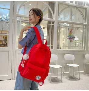 Korean style campus chic red canvas backpack detail, lightweight school bag for students.