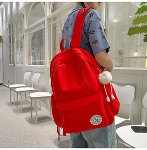 Korean style red canvas backpack with front zipper pocket, casual school bag for daily use.