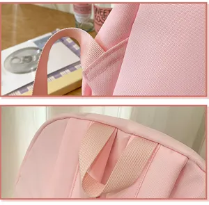 Pink student backpack detail close-up showing durable straps and fine stitching quality.