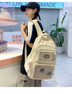 Beige canvas large capacity school backpack with transparent ita window and cute patches.