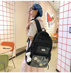 Large capacity casual black school backpack with clear front pocket for daily student use.