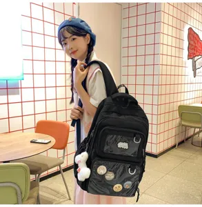 Casual large capacity black school backpack with clear window front pockets and plush pendant.