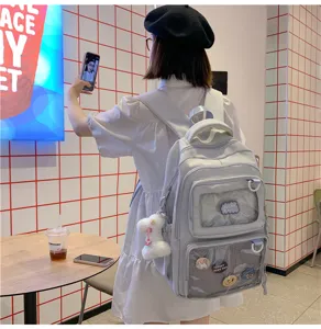 Large capacity aesthetic student backpack with clear front pocket and cute plush pendant.