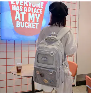 Grey large capacity canvas school backpack with transparent ita window and cute badges.