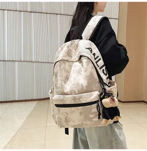 Vintage tie-dye canvas backpack with large capacity, casual stylish school bag for daily use.