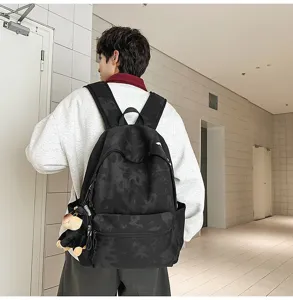 Casual retro canvas backpack with large capacity, simple printed design for daily use.