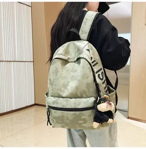 Vintage tie-dye canvas backpack with large capacity, casual stylish school bag for daily use.