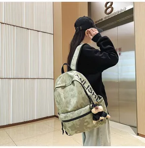 Vintage casual large capacity backpack with stylish tie-dye pattern and cute puppy pendant.
