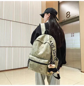 Retro large capacity canvas backpack with tie-dye pattern, casual stylish daily travel bag.