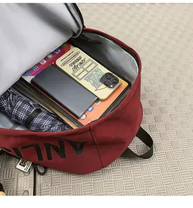 Vintage large capacity canvas backpack with stylish letter print for casual daily use and travel.