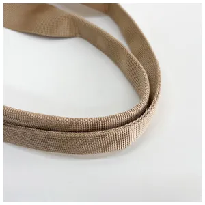 Close-up detail of durable khaki woven shoulder strap for casual daily bags and backpacks.