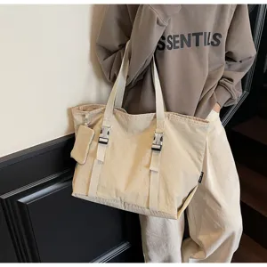 Large capacity canvas tote bag detail view, casual minimalist shoulder bag for daily commuting.