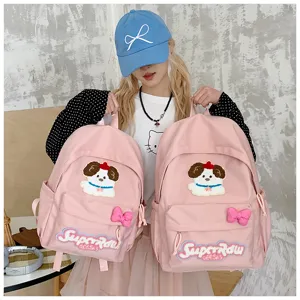 Cute Japanese style pink canvas backpack for women with puppy patch and bow detail.