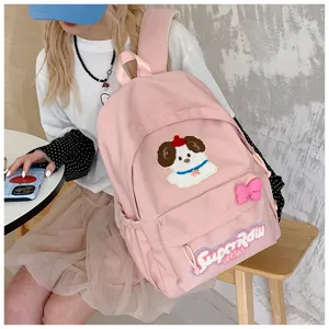 Pink cute dog embroidery backpack for women, casual sweet school bag with bow detail.