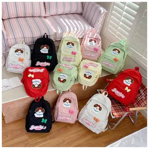 Cute candy color student backpack featuring a lovely dog embroidery and spacious storage capacity.