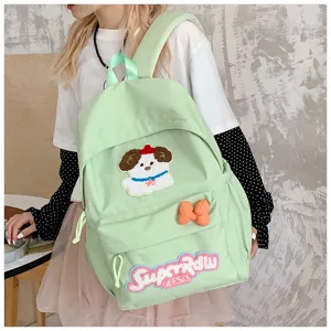 Cute Japanese style light green canvas backpack with lovely dog patch and large capacity for daily use.