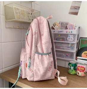Detailed view of the cute pink canvas school backpack with sweet candy color and lovely print.