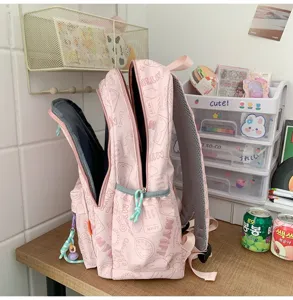 Pink cute student school backpack with all-over print design, large capacity and lightweight daily bag.