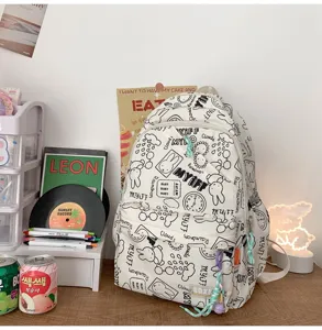 Korean ins-style white backpack with cute doodle prints, large capacity casual daily bag.