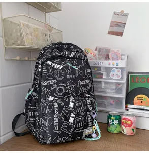 Ins style black doodle backpack for students, lightweight large capacity casual school bag.