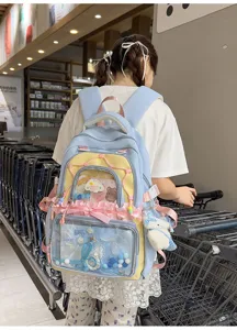 Sweet Japanese style ita backpack with clear pocket, cute bow and plush pendant for daily use.