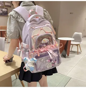 Detail view of the pastel purple ita backpack featuring clear pockets and charms.
